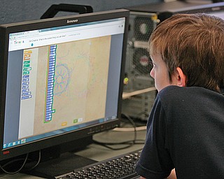 Devlin Clevenger, 13, both seventh-graders in Chaney’s Science, Technology, Engineering and Mathematics program in Youngstown schools, work to code their computer projects. All of Chaney’s STEM students participated in the Hour of Code program, which demonstrates what writing computer code is like. The students were among millions worldwide who participated in an Hour of Code as part of Computer Science Education Week. The effort was organized by Code.org and supported by Apple, Google, Microsoft, Amazon, Boys & Girls Clubs of America and more than 100 others.