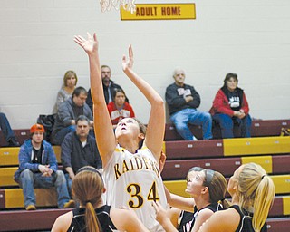 South Range’s Sara Durr (34) goes up for a basket during Monday’s victory over Mineral Ridge at South Range High School. South Range won, 70-23.
