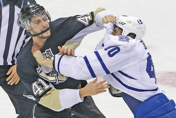 Penguins defenseman Robert Bortuzzo (41) and Maple Leafs forward Troy Bodie (40) fight in the first period of Monday’s game at Consol Energy Center in Pittsburgh. The Pens won, 3-1.