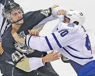 Penguins defenseman Robert Bortuzzo (41) and Maple Leafs forward Troy Bodie (40) fight in the first period of Monday’s game at Consol Energy Center in Pittsburgh. The Pens won, 3-1.