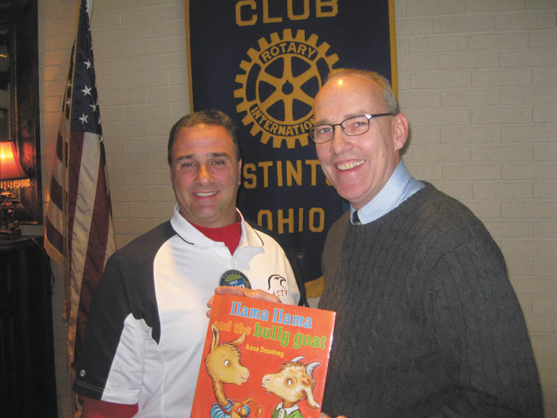 SPECIAL TO THE VINDICATOR: 
Don Terpak, right, of Zapadap Apps, recently explained the rapid growth of mobile marketing and applications on smart phones to members of the Rotary Club of Austintown. Vince Colaluca, Rotary president, honored Terpak by presenting him with a book, which will be placed in the Austintown Elementary School library.