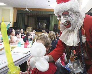 William D Lewis The Vindicator Aut Mori Grotto clown J.J. aka James Losasso, entertains children at StruthersRotary Christmas party 12-17-13 at Struthes Presbyterian Church.