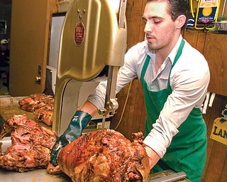 Johnny Dubic prepares slices of lamb at Dubic’s Palm Cafe.