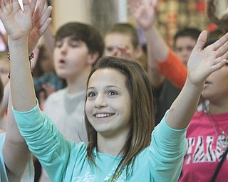 Austintown Middle School vocal music students perform at Southern Park Mall in Boardman. Among those singing and dancing Thursday was seventh-grader Kayla Kelty. The students performed four separate 15-minute holiday flash mobs to showcase their talent and spread the Christmas spirit.