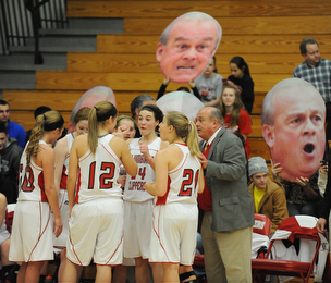 Columbiana head coach Ron Moschella talks to his starters including #21 Lauren Schlueter, #12 Aleah Whitacre, #10 Taylor Sims, #24 Emily Whitacre, and #5 Baylie Mook during a time out during the 1st half of Monday nights game.