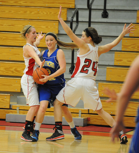 Southern #3 Mickenzie Mouts attempts to escape from the Columbiana #24 Emily Witmer and #5 Baylie Mook during the 2nd half of Monday nights game.