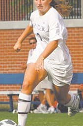 Butler University soccer player Katie Griswold heads downfield in a match against Miami University.