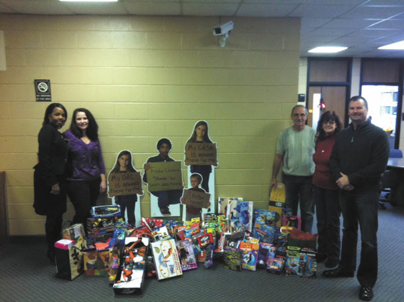 SPECIAL TO THE VINDICATOR
Cub Scout Pack 114 and the Iron Order Motorcycle Club, Youngstown chapter, donated toys for the Mahoning County CASA/GAL program children. From left are Carla Baldwin Fields, CASA board member; Cathy Kristan, assistant director of Mahoning County CASA; John Theodore and Vicki Sullivan, CASA volunteers; and Joe Rzonsa, board member. The Mahoning County CASA Program trains volunteers to speak up for abused and neglected children in juvenile court. The program is a nonprofit organization that depends on grants, donations and fundraisers.