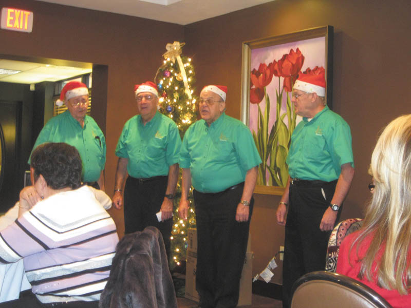 SPECIAL TO THE VINDICATOR
Vocal Alliance Barbershop Quartet, a part of the Stephen Foster Chorus of Warren, provided musical entertainment and comedy for the Austintown Friends of the Library during its Dec. 21 Christmas party. Friends program chairman Doug Wilcox invited the group and a luncheon followed their performance. Hitting all the right notes were Jack Foley, left; John McCaughan, director of the chorus; Ray Pelyhes; and Jack Martin. The next meeting of the Austintown Friends will begin at 10 a.m. Jan. 27 with speaker Dr. Donna DiBlasio of the Youngstown Steel Museum. Guests are welcome.