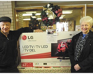 Special to The Vindicator: The Girard Multi-Generational Center sponsored a raffle recently for a 47-inch LG LED television. Winners of the TV above were June Phillips and her husband, George. Proceeds from the event benefited the center. For information about the programs and services offered at the center, call 330-545-6596 or visit www.multigen.org.