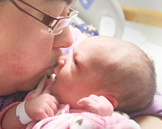 Kayla Berdine of Columbiana with her daughter, Kaysen, who was the first baby born in 2014 in the Mahoning Valley. She was born at 4:24 a.m. Wednesday at St. Elizabeth Health Center.