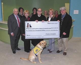 SPECIAL TO THE VINDICATOR:
The Morris and Phyllis Friedman Foundation donated $25,000 to the Animal Welfare League of Trumbull County in October. It was presented by Steve Friedman. In front, from left, are Ned Gold, Ali Patterson, Steven Friedman, Caryn Covelli and Dr. John Owen; in back are Barbara Busko, Mary Busko, Margie McCummins and Ellen Parker.