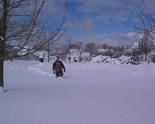David Dull is shown trekking through the snow in St. Joseph, Michigan. David was visiting his aunt and uncle for the annual Ice Festival in February 2012. Sixteen inches of lake-effect snow fell overnight. The photo was submitted by his mom, Marla Dull.