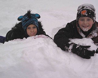 Andrea and David Dull are playing with (eating?) the snow in their backyard in Hubbard in the winter of 2012. Submitted by mom, Marla Dull.