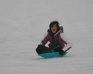 Dana gets a thrill out of sledding on the hill at Crandall Park. Photo was taken by her mom, Angie.