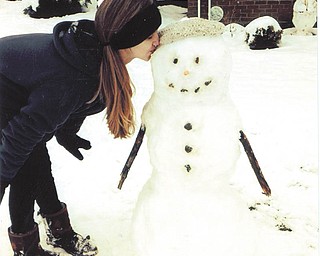 Allison Joyce, who was visiting Ohio from Atlanta on Thanksgiving 2013, built a snowman. Sent by grandma Marda Sincel of New Middletown.