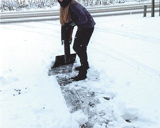 Allison Joyce from Atlanta was entertained by shoveling snow as part of the Thanksgiving holiday. Sent by Grandma Marda Sincel.