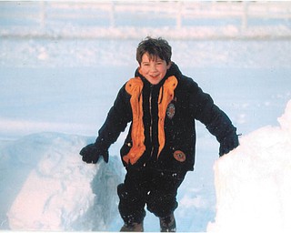 Aaron Hartsough of Canfield took pleasure in swinging on snowballs. Taken by Lana Vanauker.