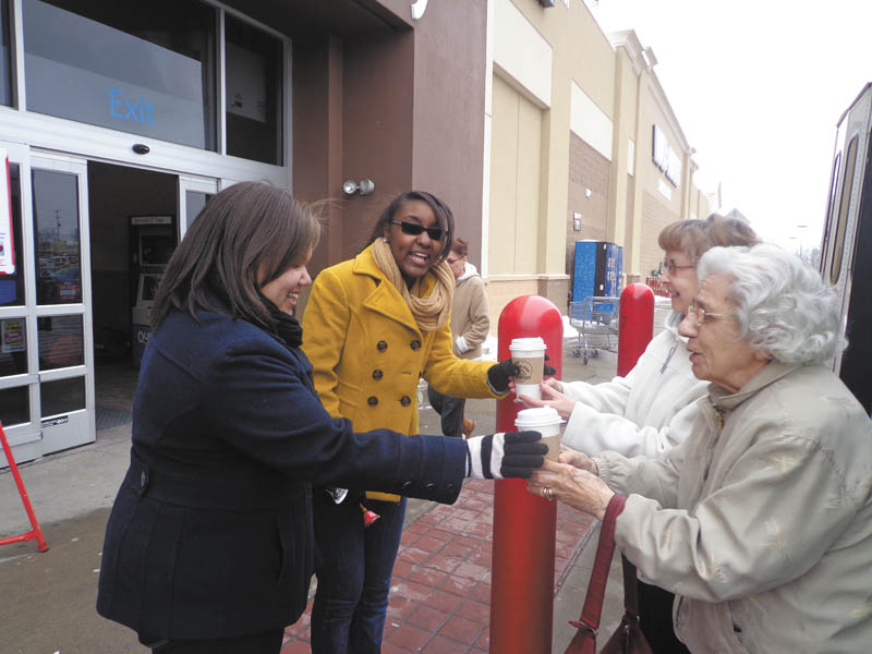 SPECIAL TO THE VINDICATOR
The Brookdale Elves, seniors from Clare Bridge Austintown and Sterling House Youngstown, provided hot chocolate to Salvation Army bell-ringers from Dec. 4 at various times and locations through the holiday season. Jo for the Road provided the hot chocolate at a discount. Above, from left, are Taylor and Raven, Salvation Army volunteers working in front of Walmart in Austintown, who were served hot chocolate by elves Dorothy Thomas and Marguerite Cronin. Below, Salvation Army volunteer Heather, left, is receiving her hot chocolate from Thomas in front of Giant Eagle, also in Austintown.

