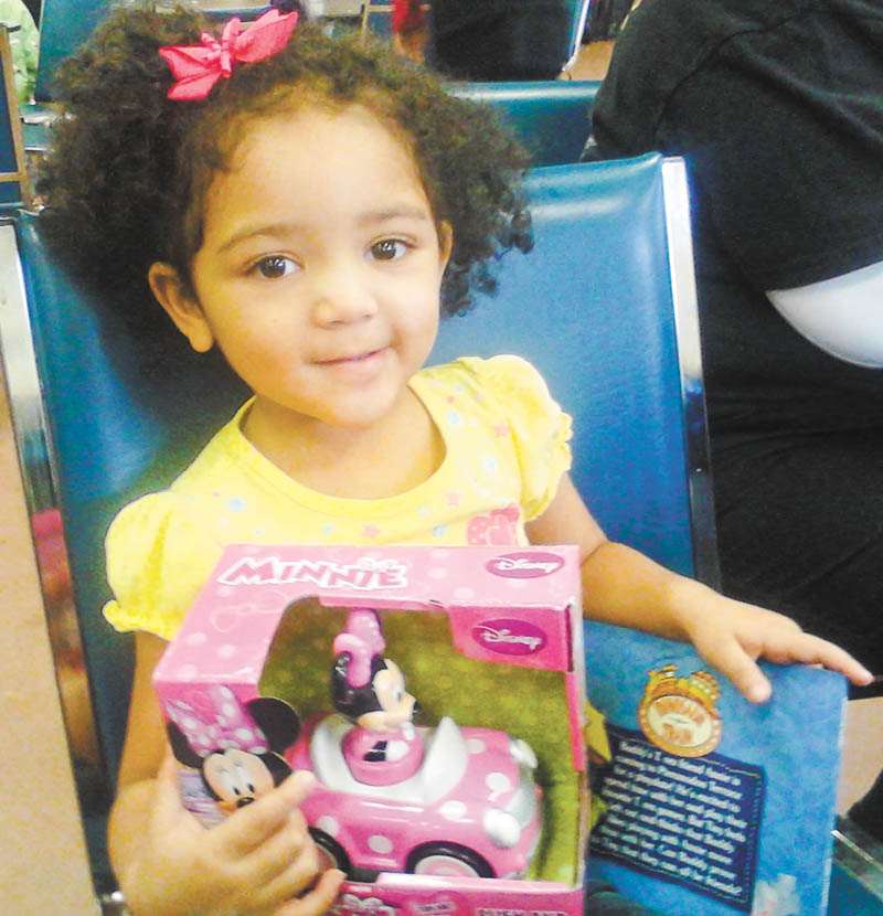 SPECIAL TO THE VINDICATOR
OCCHA Inc., the Hispanic American Civic and Cultural Organization, hosted its 41st annual Three Kings Celebration on Jan. 4 at the OCCHA Hall, 3660 Shirley Road, Youngstown. Free lunches and toys were given to 180 low-income children. The Epiphany is celebrated in Latin American countries on Jan. 6. Gifts are given to the children, symbolizing the gifts given to baby Jesus. The event is sponsored in part by the Latin American Motorcycle Association Youngstown Chapter and private donations. Above, Leticia Vargas, 2, holds her gift at the celebration.