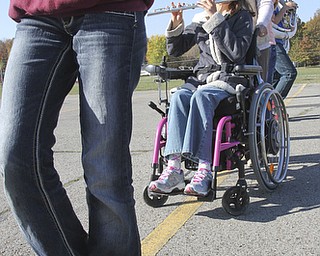 William D Lewis The Vindicator Kaitlin Windt at Boardman HS 10-30-13. She is in a wheelchair and performs with the Boardman Marching band. Attendent Audrey Allen helps with her wheel chair.