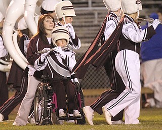 William D LEwis The Vindicator Boardman band member Kaitlin Windt, in wheelchair, gets help from Rachael Ruggieri during 11012013 halftime show.