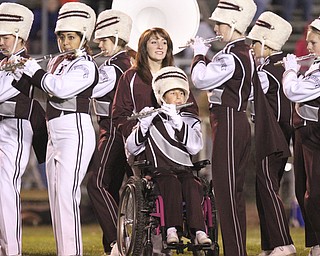 William D LEwis The Vindicator Boardman band member Kaitlin Windt, in wheelchair, gets help from Rachael Ruggieri during 11012013 halftime show.