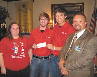 SPECIAL TO THE VINDICATOR
The Austintown Fitch Robotics Team, Falco Tech, received a generous donation for their competition expenses from the Rotary Club of Austintown at its Jan. 6 meeting. On the right is Mark Cole, Rotary president, who presented the check to robotics team members Eileen Yantes, left, Wes Pringle and Zack Venzio. The robotics team is sponsoring a Lego competition today at Austintown Middle School. The Rotary meeting’s speaker was Amanda Lynch of Impact for Animals, and special guest was Michael Shane, a former Fitch Interact Club president, who is involved in the food business in China.
