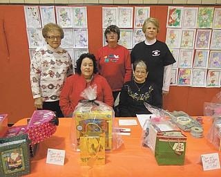 SPECIAL TO THE VINDICATOR
Girard Junior Women, seated from left, are Sue Ellen Harris and Collete Chuey; and standing are Marilyn Kobal, Roberta Lawrentz and Kathy Rossell, some of the volunteers for the annual bazaar in December. All proceeds are donated to the Girard community. Their next fundraiser will be a trunk and treasure sale in May. For information about this fundraiser or membership call 330-545-5962.