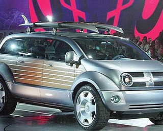 The Dodge Kahuna concept vehicle is unveiled at the North American International Auto Show in Detroit. Aimed at surfers, the Kahuna was a cross between a Woodie wagon and a minivan.