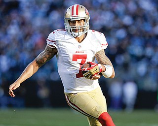 San Francisco 49ers quarterback Colin Kaepernick carries the ball against the Carolina Panthers during the
second half of an NFC divisional playoff game Sunday in Charlotte, N.C.