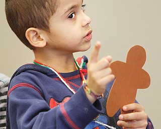 Jahmaray Williams puts some emphasis on a song about gingerbread men as E.J. Blott students entertained at Levy Gardens on Wednesday.