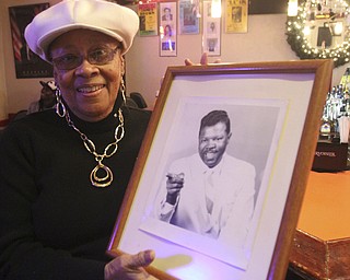 william D. Lewis The Vindicator  Frieda Anderson Martin owner of popular longtime jazz club , Frieda's on Y-towns Northside hold a photo of local musician Boogie D who helped her get live music started at the club.