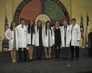 SPECIAL TO THE VINDICATOR
The Raabe College of Pharmacy at Ohio Northern University sponsored a professional commitment white-coat ceremony in November. The ceremony is for third-year pharmacy majors. Eight 2011 high school graduates from the area participated. They are, from left, Lauren DePietro, Cardinal Mooney; Matthew Smaldino, Amanda Volosin and Danielle Petrus, all of Boardman; Adriana Sikora, Poland; Helena Ladd, Boardman; Pat Gayetsky, Poland; and Eric Sklenar, Mooney.