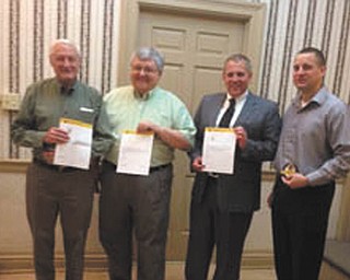 SPECIAL TO THE VINDICATOR
The Youngstown Lions Club recently recognized members for their service with a Chevron Award from Tom Zickafoose, district governor. From left are Don Mathews, 25 years; Ron Serich, 10 years; and Pete Noll, 15 years. Bill Ruggles, last year’s president, received a patch for a successful year in 2012-2013. Other award recipients were George Kolesar, 15 years; Ron Smith, 25 years; and Bill Bennett, 30 years. 