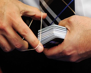 A McAllen Police detective collects credit cards that were confiscated by police after arresting a man and a woman on fraud charges Monday in McAllen, Texas. According to a South Texas police chief, the suspects used account information stolen during the Target security breach to buy tens of thousands of dollars’ worth of merchandise, but a spokesman for the U.S. Secret Service said Tuesday that an investigation is ongoing into the possibility of a link between the Target data breach and the arrests.