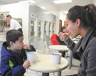 Tiffany Polish and her son, Logan, 4, enjoy a treat at Naticakes.