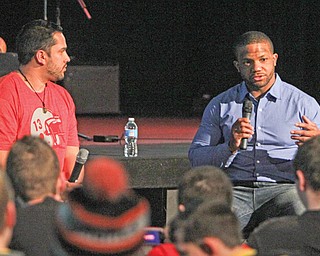 Former Warren Harding and Ohio State football standout Maurice Clarett, right, addresses the audience during a speaking engagement Wednesday at The Riot youth center of Victory Assembly of God in Coitsville. Over 150 youths from northeastern Ohio and western Pennsylvania attended the event, which was sponsored by Victory Revolution Youth Ministry, which is headed by Pastor Nate Ortiz, left, a friend of Clarett.