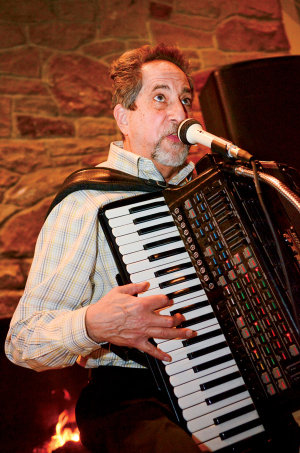 Jim Frank of the Jim Frank Trio sings and plays the accordion during a winter concert recently at Yellow Creek Park in Struthers.