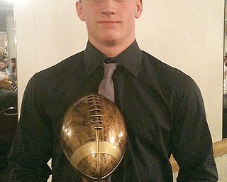 Brendan Baugher of Southington poses with the Curbstone Coaches’ Byrd Giampetro Scholarship Award during
ceremonies at their annual all-league football recognition banquet Sunday at The Georgetown in Boardman.