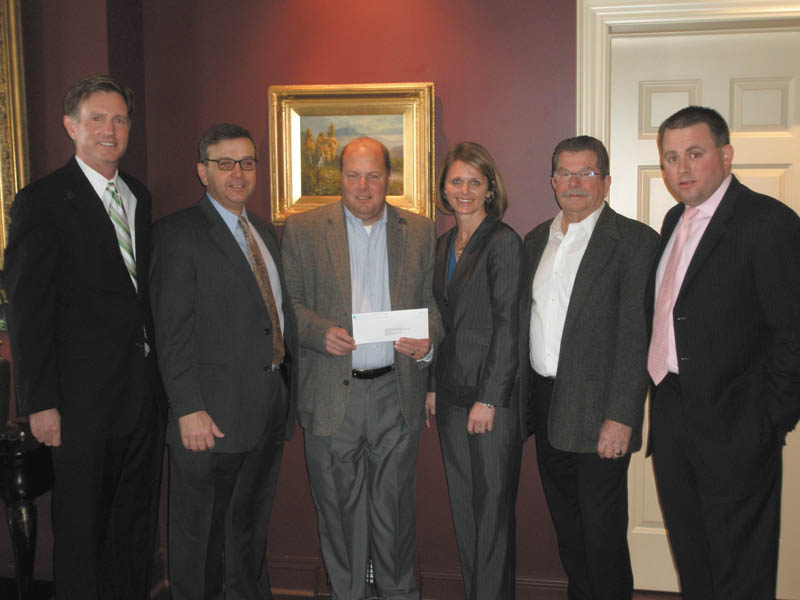 Bill Strimbu, president of Nick Strimbu Inc. and a founder of the Strimbu Memorial Fund, received a check for $22,000 from Melissa Scheffler of Chubb Insurance. A team sponsored by the HDH Group placed seventh in a national golf tournament and donated its winnings to the Strimbu Fund. From left to right are Steve Leon, HDH Group; Jim Grasso, Liberty Steel and vice president of the Strimbu Fund; Strimbu; Scheffler: Paul O’Brien of Rien Construction and president of the Strimbu Fund; and Joe Totten of the HDH Group. 
SPECIAL TO THE VINDICATOR
