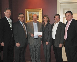 Bill Strimbu, president of Nick Strimbu Inc. and a founder of the Strimbu Memorial Fund, received a check for $22,000 from Melissa Scheffler of Chubb Insurance. A team sponsored by the HDH Group placed seventh in a national golf tournament and donated its winnings to the Strimbu Fund. From left to right are Steve Leon, HDH Group; Jim Grasso, Liberty Steel and vice president of the Strimbu Fund; Strimbu; Scheffler: Paul O’Brien of Rien Construction and president of the Strimbu Fund; and Joe Totten of the HDH Group. 
SPECIAL TO THE VINDICATOR