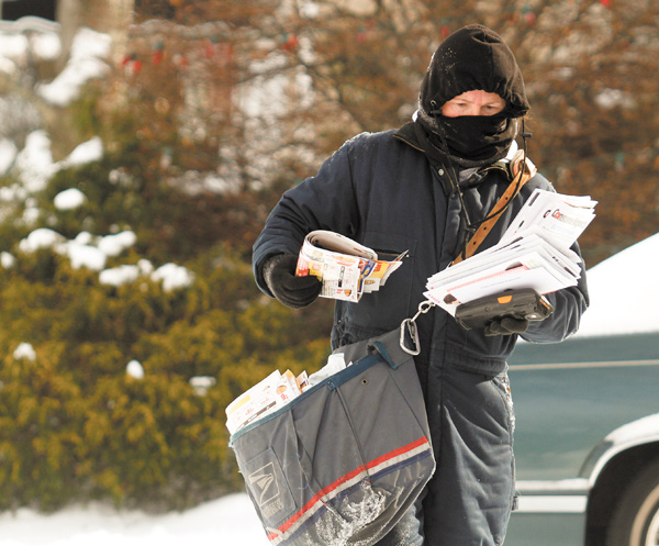 Carmen George makes sure to dress in layers when she delivers mail in Boardman during extremely cold weather.