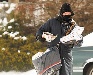 Carmen George makes sure to dress in layers when she delivers mail in Boardman during extremely cold weather.