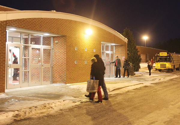 Basketball fans enter the Canfield High School gym to watch Wednesday’s game between the Cardinal boys and Howland. The recent cold snap has caused numerous school across the Valley to close and cancel many of their
sporting and club events.
