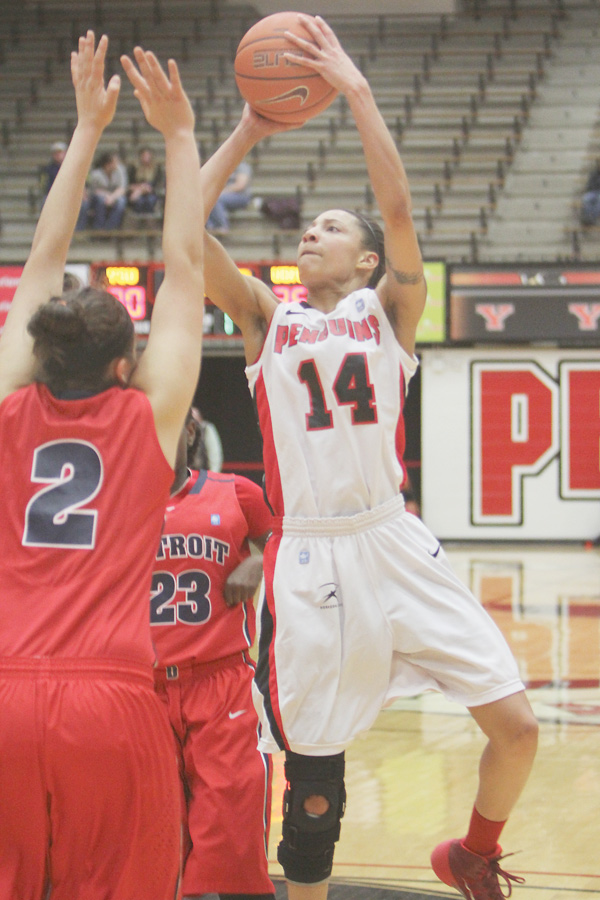 Youngstown State’s Karen Flagg shoots a jump shot over Detroit defenders Haleigh Ristovski (2) and Senee Shearer (23) during the first half of Wednesday’s game at YSU’s Beeghly Center. Flagg had a career-high 26 for the Penguins, who downed the Titans, 80-71, and are 6-0 in Horizon League play.