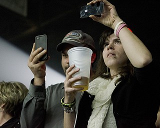 Katie Rickman | The Vindicator.Two fans take cell phone pictures during the first song at Elton John's concert at the Covelli Centre Saturday, February 1, 2014.