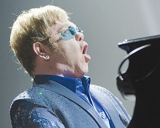 Elton John sings ‘‘Funeral for a Friend/Love Lies Bleeding” during the opening of his concert at the Covelli Centre on Saturday night.