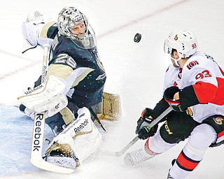 Pittsburgh Penguins goalie Marc-Andre Fleury (29) makes a save on a shot by Ottawa Senators’ Mika Zibanejad
(93) in the first period of a game in Pittsburgh.