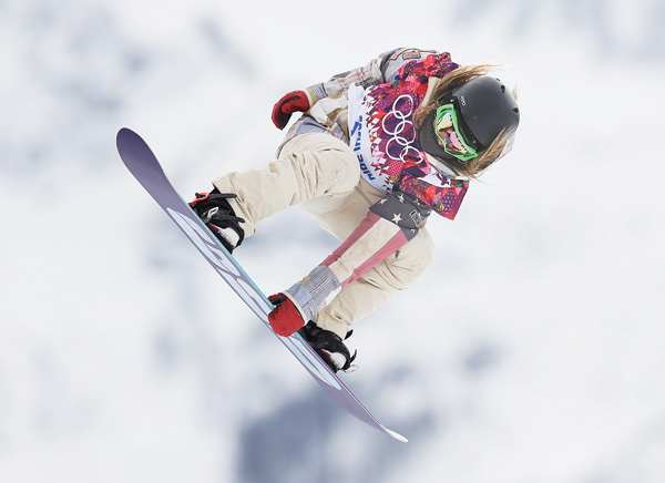 Jamie Anderson of the United States takes a jump on her first run in the women’s snowboard slopestyle final Sunday at the 2014 Winter Olympics in Krasnaya Polyana, Russia.